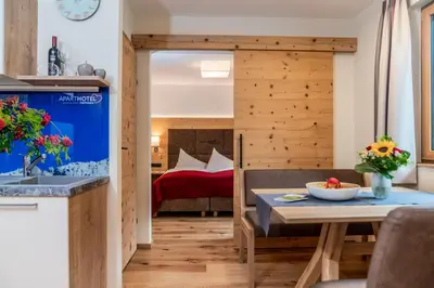 Ein Bett oder Betten in einem Zimmer der Unterkunft Aparthotel Ramsau