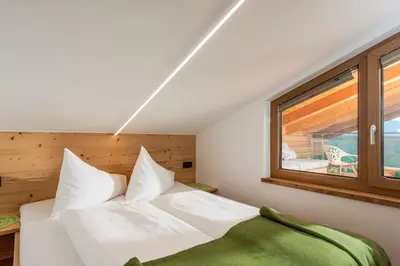 Ein Bett oder Betten in einem Zimmer der Unterkunft Aparthotel Ramsau