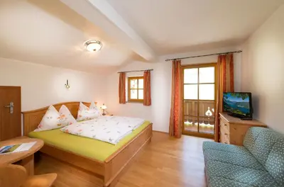 Ein Bett oder Betten in einem Zimmer der Unterkunft Mitterbichlhof