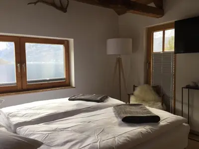 Ein Bett oder Betten in einem Zimmer der Unterkunft Bootshaus am Hallstätter See
