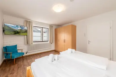 Ein Bett oder Betten in einem Zimmer der Unterkunft apartHAUS - by myNests