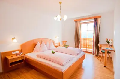 Ein Bett oder Betten in einem Zimmer der Unterkunft Berggasthof Bliembauer