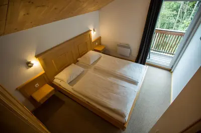 Ein Bett oder Betten in einem Zimmer der Unterkunft Alpendorf Dachstein West by ALPS RESORTS