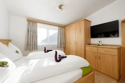 Ein Bett oder Betten in einem Zimmer der Unterkunft Appartement Mayrhofer - Ferienwohnungen