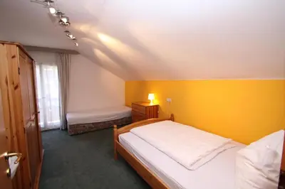 Ein Bett oder Betten in einem Zimmer der Unterkunft Pension Reiterhaus
