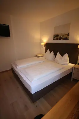 Ein Bett oder Betten in einem Zimmer der Unterkunft Appartementhaus Brunnenhof