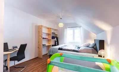 Ein Bett oder Betten in einem Zimmer der Unterkunft Das Dorfnest