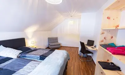 Ein Bett oder Betten in einem Zimmer der Unterkunft Das Dorfnest