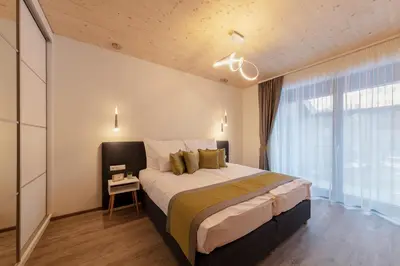 Ein Bett oder Betten in einem Zimmer der Unterkunft ARTMUR Apartment