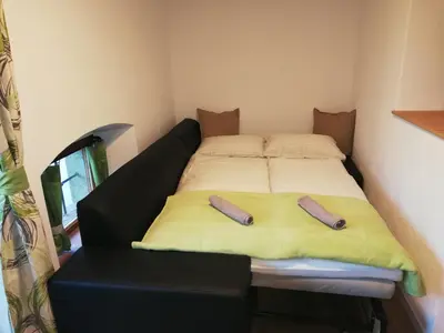 Ein Bett oder Betten in einem Zimmer der Unterkunft Hoamatleuchten
