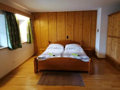 Ein Bett oder Betten in einem Zimmer der Unterkunft Hoamatleuchten