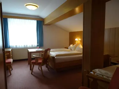 Ein Bett oder Betten in einem Zimmer der Unterkunft Hotel Sportpension Reiter