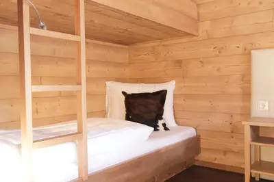 Ein Bett oder Betten in einem Zimmer der Unterkunft Alpenchalets Flachauer Gutshof