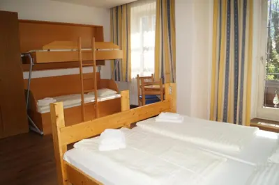 Ein Bett oder Betten in einem Zimmer der Unterkunft Hotel YOUHEY am Wolfgangsee