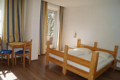 Ein Bett oder Betten in einem Zimmer der Unterkunft Hotel YOUHEY am Wolfgangsee