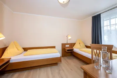 Ein Bett oder Betten in einem Zimmer der Unterkunft Ziehrerhaus