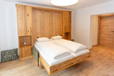Ein Bett oder Betten in einem Zimmer der Unterkunft Juche! Ferienwohnungen