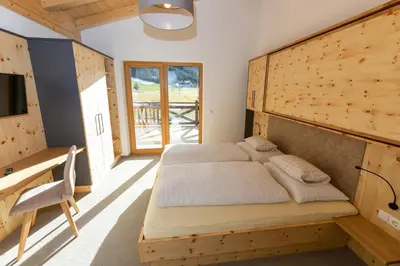 Ein Bett oder Betten in einem Zimmer der Unterkunft Juche! Ferienwohnungen