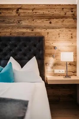 Ein Bett oder Betten in einem Zimmer der Unterkunft Hotel Happy Filzmoos
