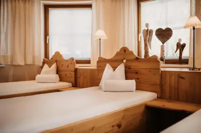 Ein Bett oder Betten in einem Zimmer der Unterkunft Hotel Happy Filzmoos