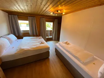 Ein Bett oder Betten in einem Zimmer der Unterkunft Flachau Lodge