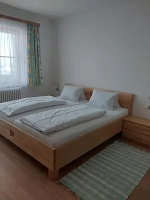 Ein Bett oder Betten in einem Zimmer der Unterkunft Maierlhof