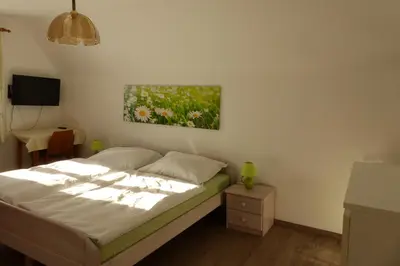 Ein Bett oder Betten in einem Zimmer der Unterkunft Ferienhaus Wohleser