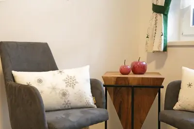Ein Sitzbereich in der Unterkunft Apartments Schmiedgut