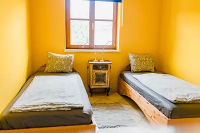 Ein Bett oder Betten in einem Zimmer der Unterkunft Tauglerei Appartement Enzian in den Zauberbergen