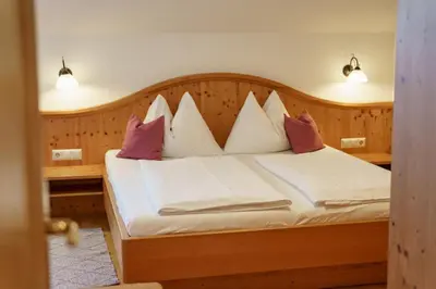 Ein Bett oder Betten in einem Zimmer der Unterkunft Kainreiterhof