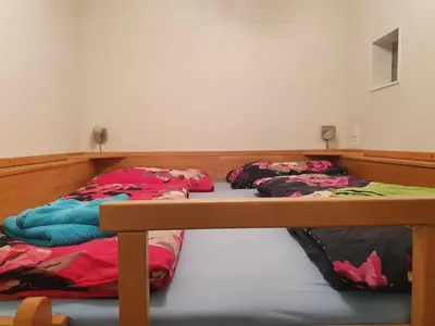 Ein Bett oder Betten in einem Zimmer der Unterkunft Höss-Alpin-Lodge