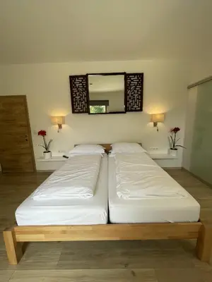 Ein Bett oder Betten in einem Zimmer der Unterkunft Sprungschanze Haus