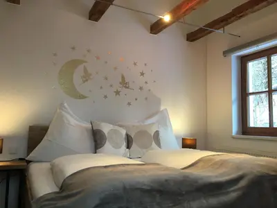 Ein Bett oder Betten in einem Zimmer der Unterkunft Loft Krämerhaus Annaberg, Dachstein West