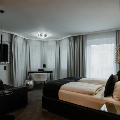 Ein Bett oder Betten in einem Zimmer der Unterkunft The Place Boutique & Design Hotel Flachau