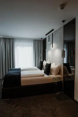 Ein Bett oder Betten in einem Zimmer der Unterkunft The Place Boutique & Design Hotel Flachau