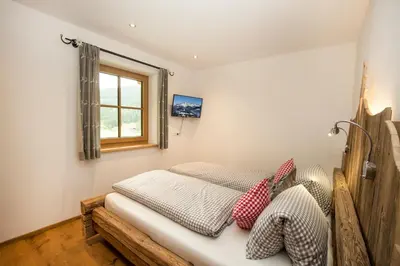 Ein Bett oder Betten in einem Zimmer der Unterkunft Alpenherz