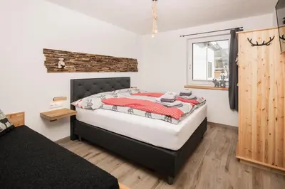 Ein Bett oder Betten in einem Zimmer der Unterkunft Pistenblick Alpin