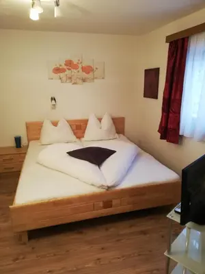 Ein Bett oder Betten in einem Zimmer der Unterkunft Gaestehaus-Russegger