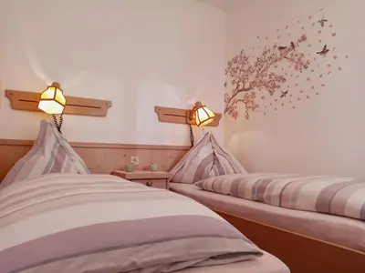 Ein Bett oder Betten in einem Zimmer der Unterkunft Landhaus Hirterhütte