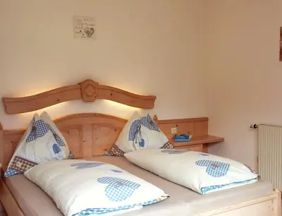 Ein Bett oder Betten in einem Zimmer der Unterkunft Landhaus Hirterhütte