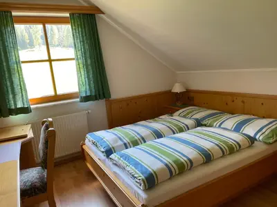 Ein Bett oder Betten in einem Zimmer der Unterkunft Ferienhaus Alpenblick