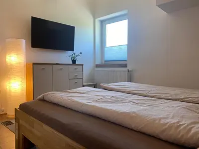 Ein Bett oder Betten in einem Zimmer der Unterkunft Haus Kampl - Appartement Grundlsee