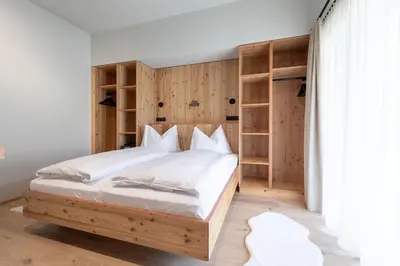 Ein Bett oder Betten in einem Zimmer der Unterkunft das bleibt Alpine Suites