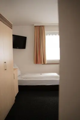 Ein Bett oder Betten in einem Zimmer der Unterkunft Frühstückspension Auer - Haus Kargl
