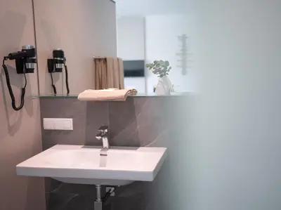 Ein Badezimmer in der Unterkunft eee Hotel Liezen