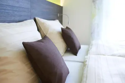 Ein Bett oder Betten in einem Zimmer der Unterkunft eee Hotel Liezen