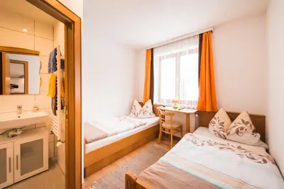 Ein Bett oder Betten in einem Zimmer der Unterkunft Hotel Pension Barbara