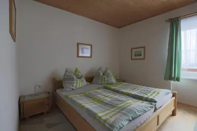 Ein Bett oder Betten in einem Zimmer der Unterkunft Ferienwohnungen Matzner