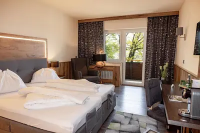 Ein Bett oder Betten in einem Zimmer der Unterkunft Hotel Attersee