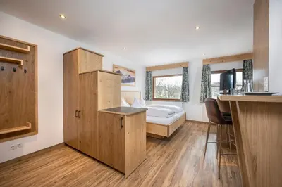 Ein Bett oder Betten in einem Zimmer der Unterkunft Tauerncamping Apartment